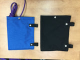 1 blue + 1 black pouch laying next to each other with purple drawcord sticking out of the blue one