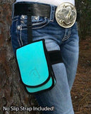 close up of Teal Horse Holster worn on thigh of a woman