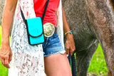 woman leading an Appaloosa horse wearing a Teal HH