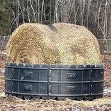 EcoNets EZ Feeder kit on a black poly AGI feeder with a full round bale of hay