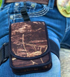 Image of Mossy Oak Horse Holster being worn on the thigh showing the pocket clip and grippy leg strap