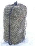 1.5" Square bale net on a square bale standing up in the snow
